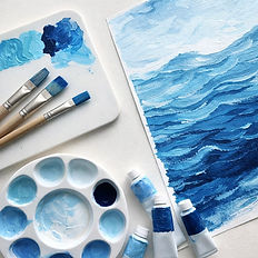 Canvas and color painted brushes with cool colors