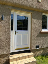 White Bel'm residential door with window and tiled steps