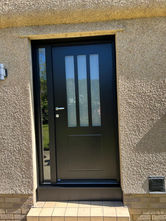 Modern black Bel'm residential door with vertical windows