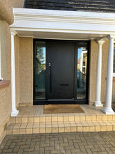 Modern black Bel'm residential door with side panels
