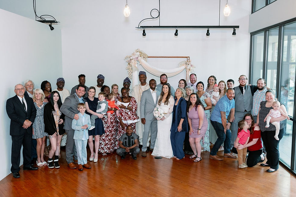 All the wedding guests pose for a family/friends photo 