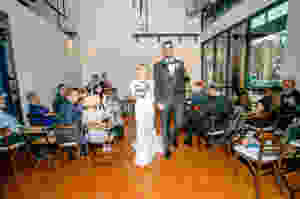 bride and groom recessional following tiny elopement wedding at Loft of Elements Preserved in Elgin, IL