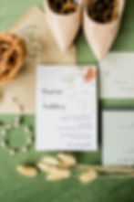 invitation and details flatway includng terra cotta rose and brides neutral shoes