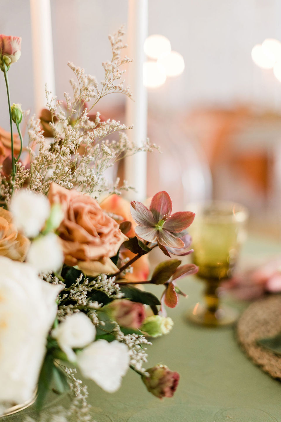 floral centerpiece in rust and terra cotta accents