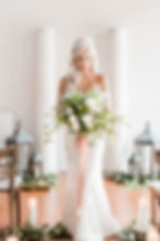 vintage pillars create a unique backdrop, along with a variety of beautiful lanterns