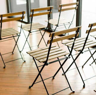 wooden bistro chairs are included for ceremony seating set up and strike for every wedding at The Loft!
