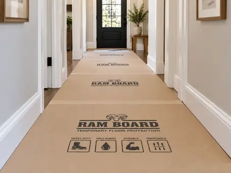 Ram Board protection covering a hallway during a home remodeling project.