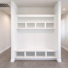 Custom built-in shelving and storage in San Antonio featuring multiple cubbies for additional closet space.