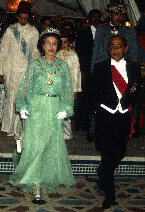 The Queen at a Royal Banquet in Morocco in 1980s wearing a long green chiffon gown
