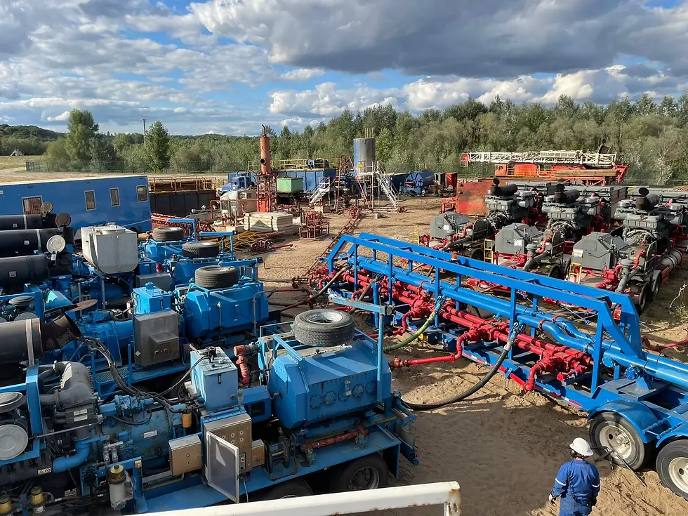 Red and blue frac pump units on site in North America