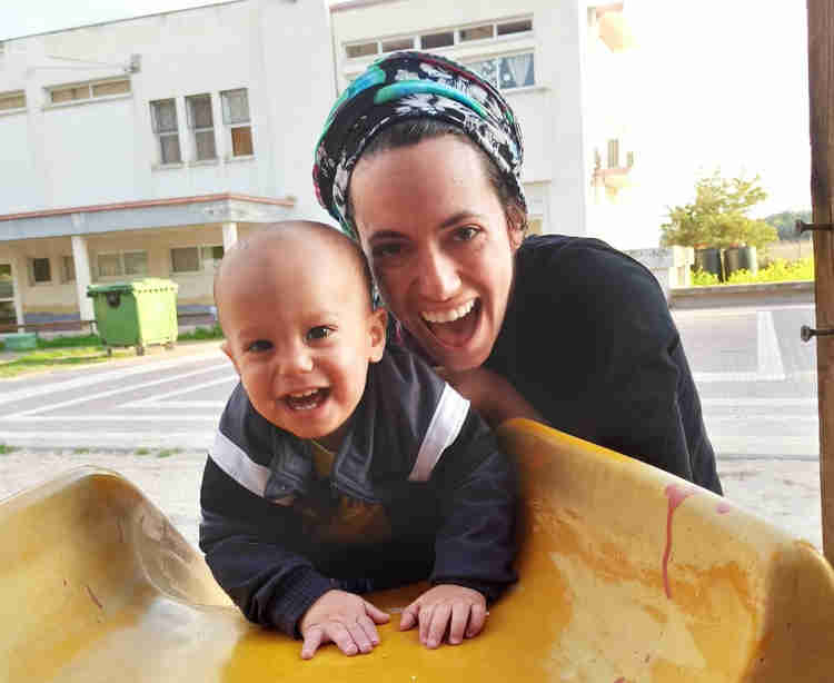 #Meet_the_Oleh, Maddie De Silva, with her baby son on a slide