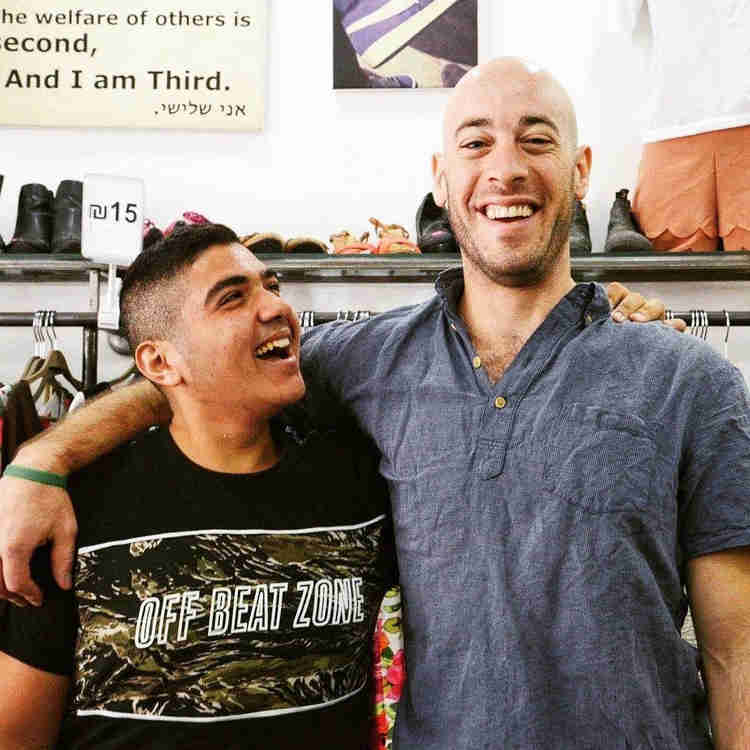 Oleh, David Baskin standing in one of his Ani Shlishi shops with a young man