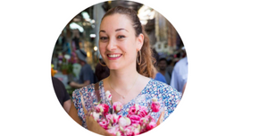 Olah Yudith Guttman holding a bouquet of flowers