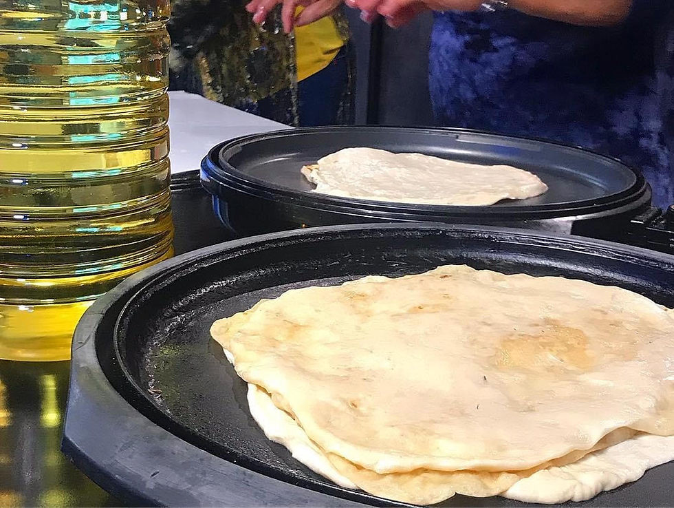 moflettot, a Morrocan-Jewish thin crepe, covered with butter and nuts, and drenched in honey and syrup