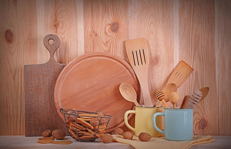 utensil-with-cookies-nuts-wooden-background_392895-297793.jpg
