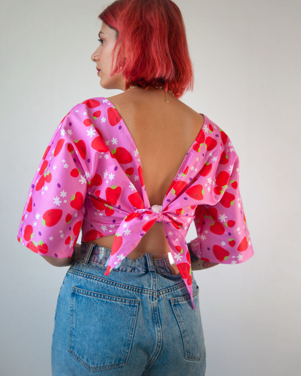 Thumbnail: Organic cotton reversible wrap top in "Strawberries" textile design