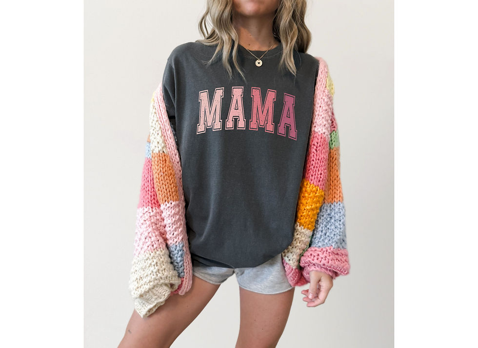 Close-up of a pink mama T-shirt styled with a denim jacket and black jeans on a city street