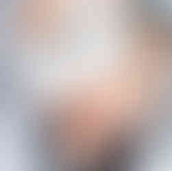 1. Child hugging his mom tightly during a warm, playful moment on the bed.