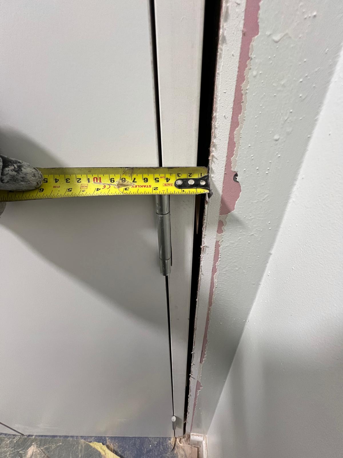 Measuring the frame-to-wall opening before making good, Burlington Court