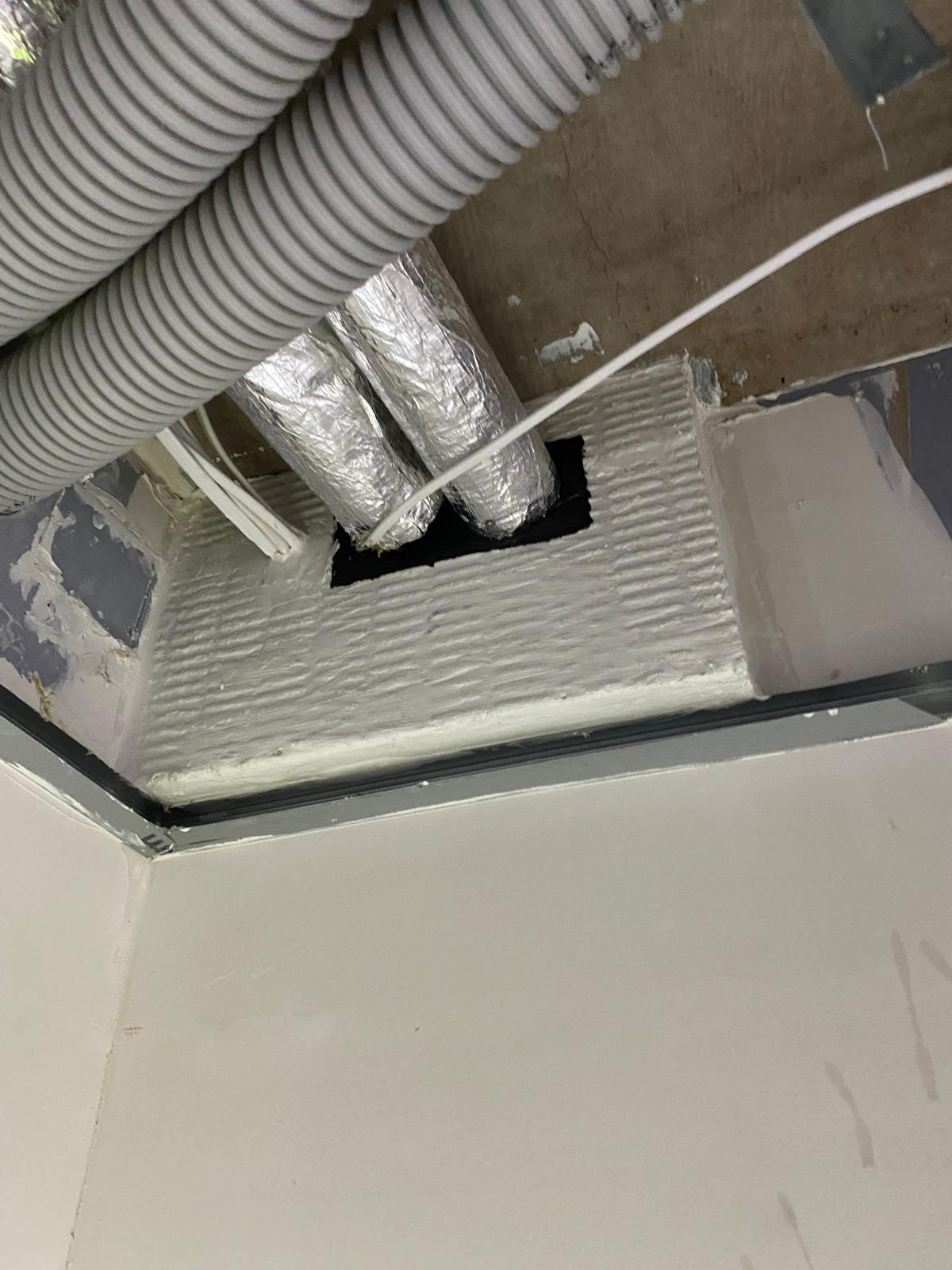 Insulated service ducts through a batt panel, Cobham firestopping project