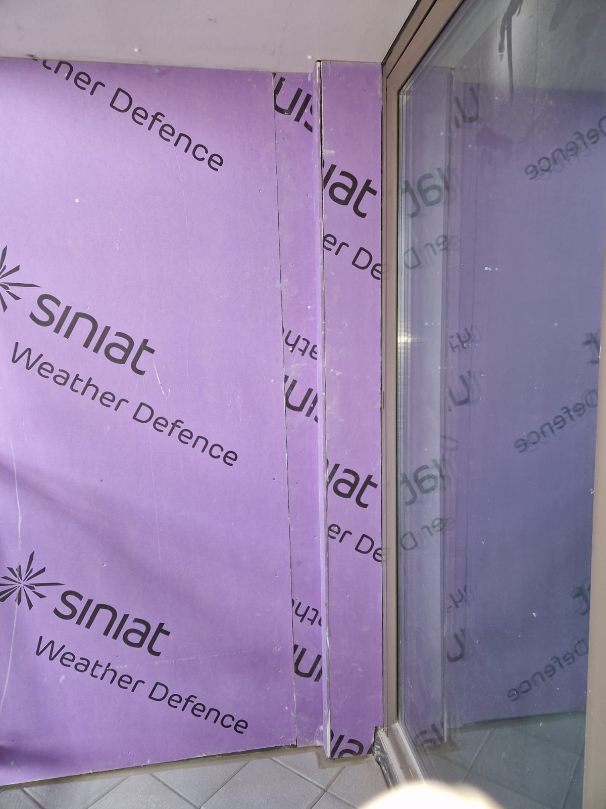 Weather Defence boards at a glazed opening, Oak Square