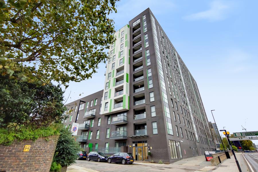 Tweed House exterior with balconies and green façade panels