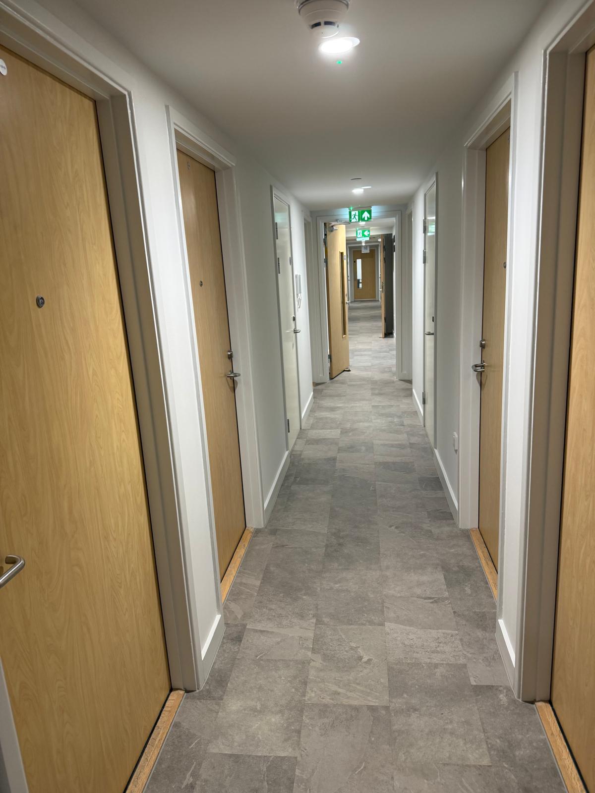 Timber doors along the residential corridor, Paragon Estate