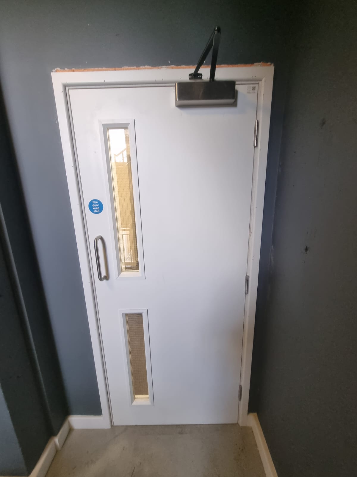 Stair doorset with overhead closer, Warwick Apartments