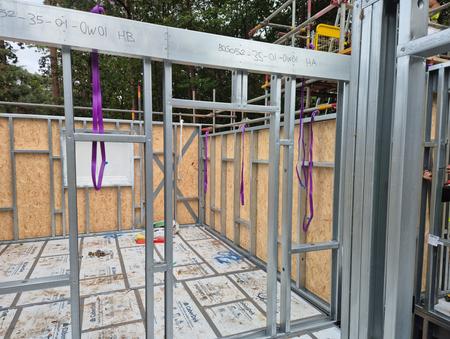 Prefabricated wall panels during installation at Deepcut UniHouse