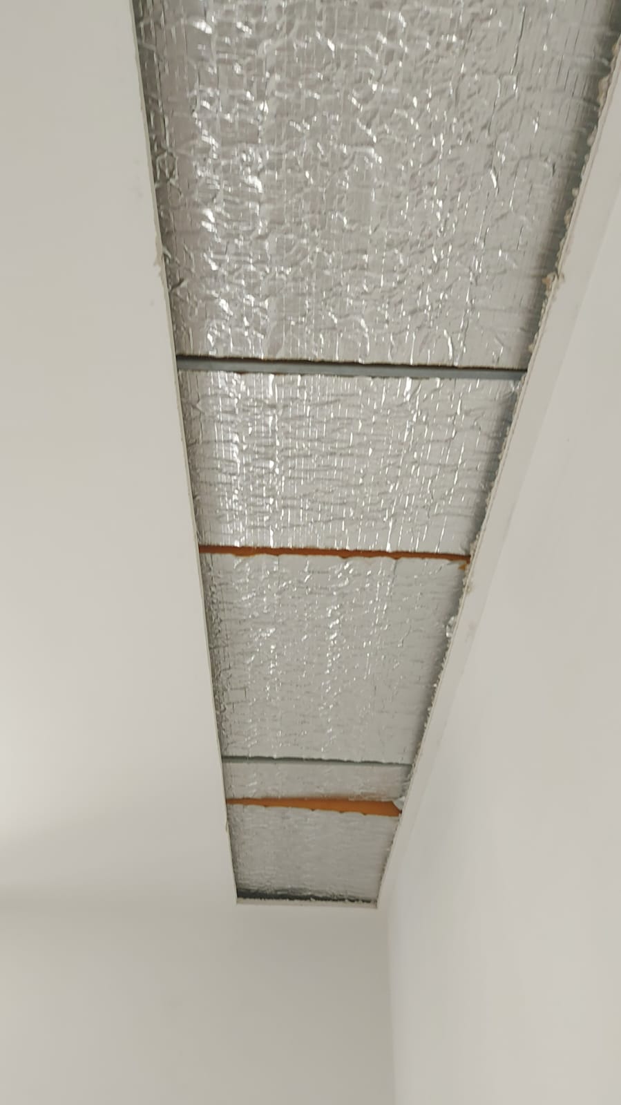Reflective lining exposed above the ceiling, Oak Square