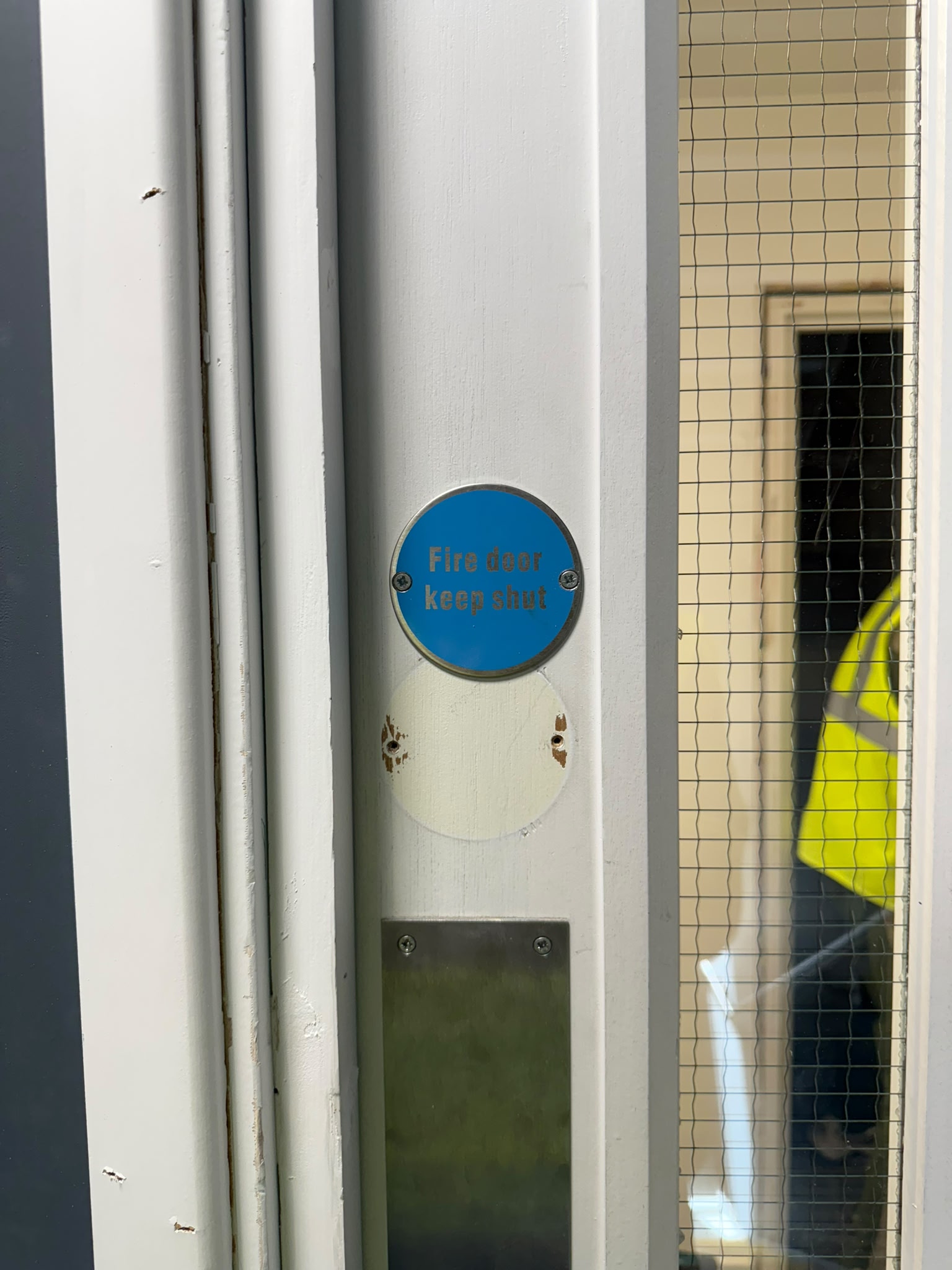 Fire-door signage and vision panel, Blenheim Apartments