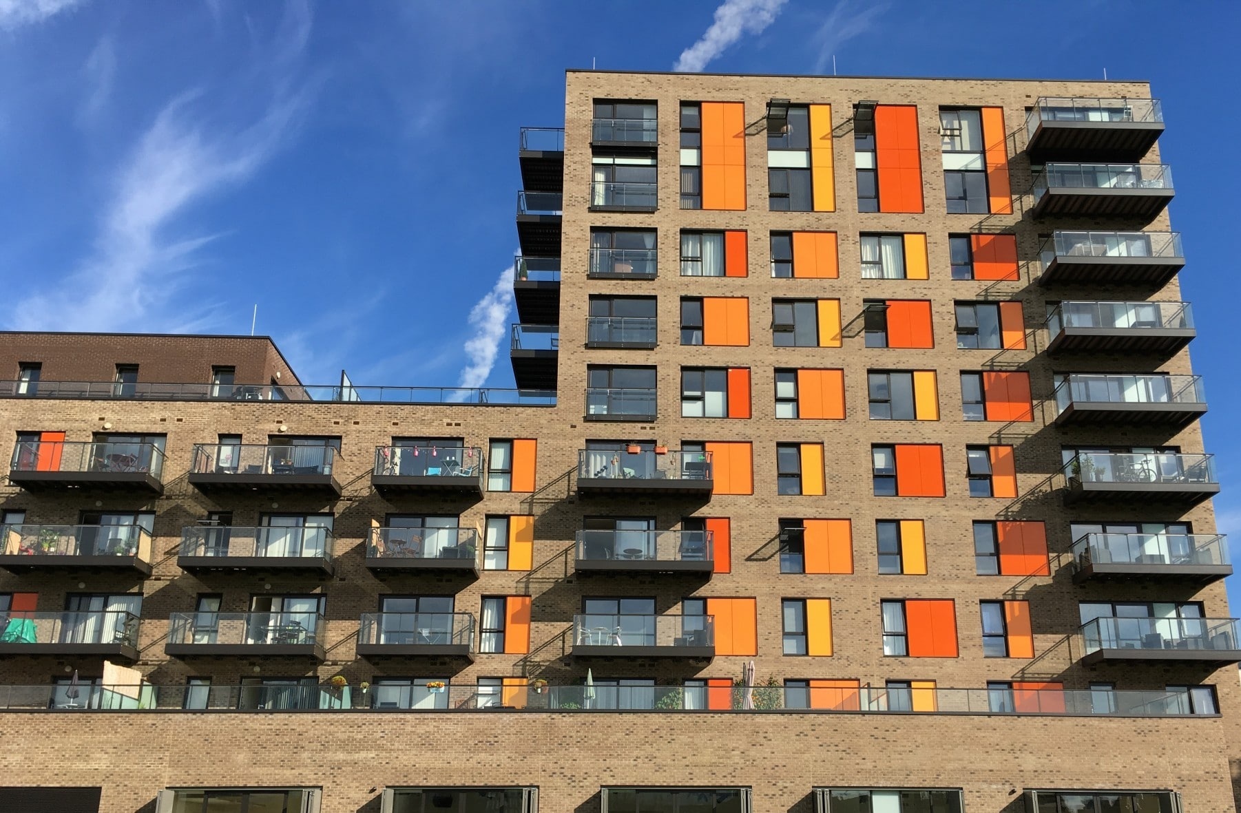 Barlett Park exterior with brickwork, orange façade panels and balconies