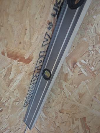 Checking panel alignment with a spirit level, Deepcut UniHouse