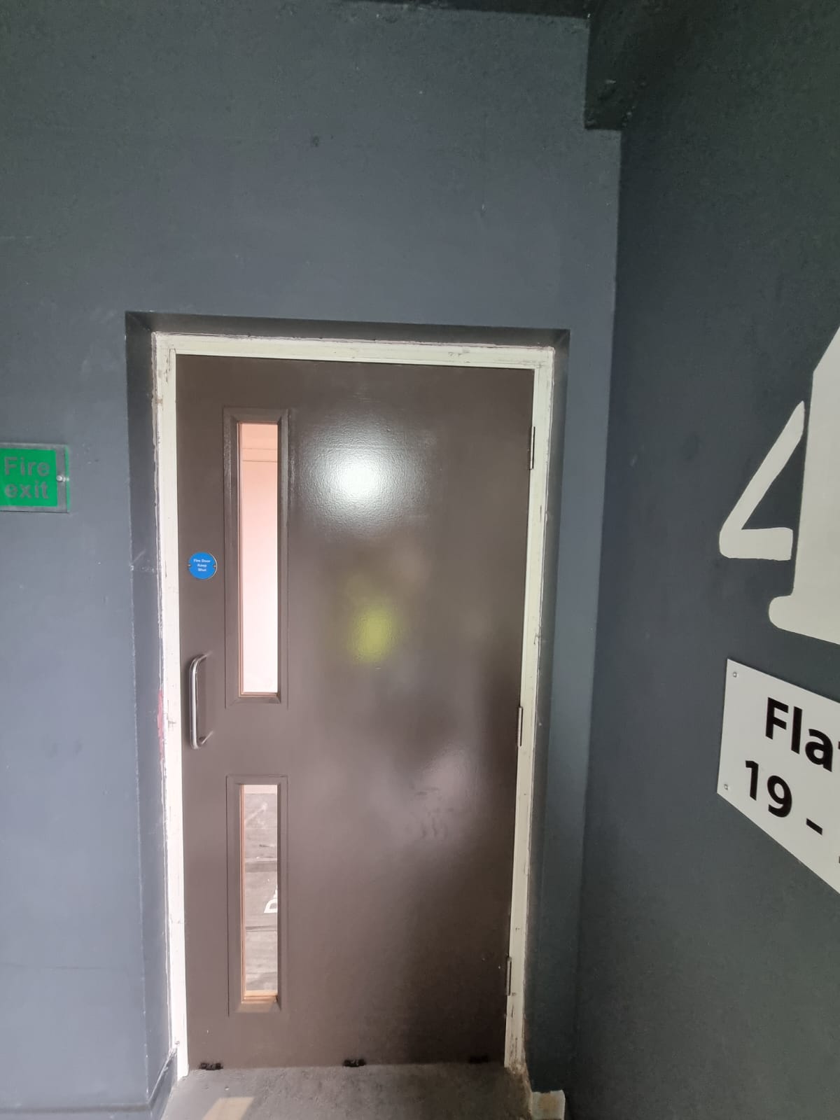 Glazed corridor door and fire-door signage, Barlett Park