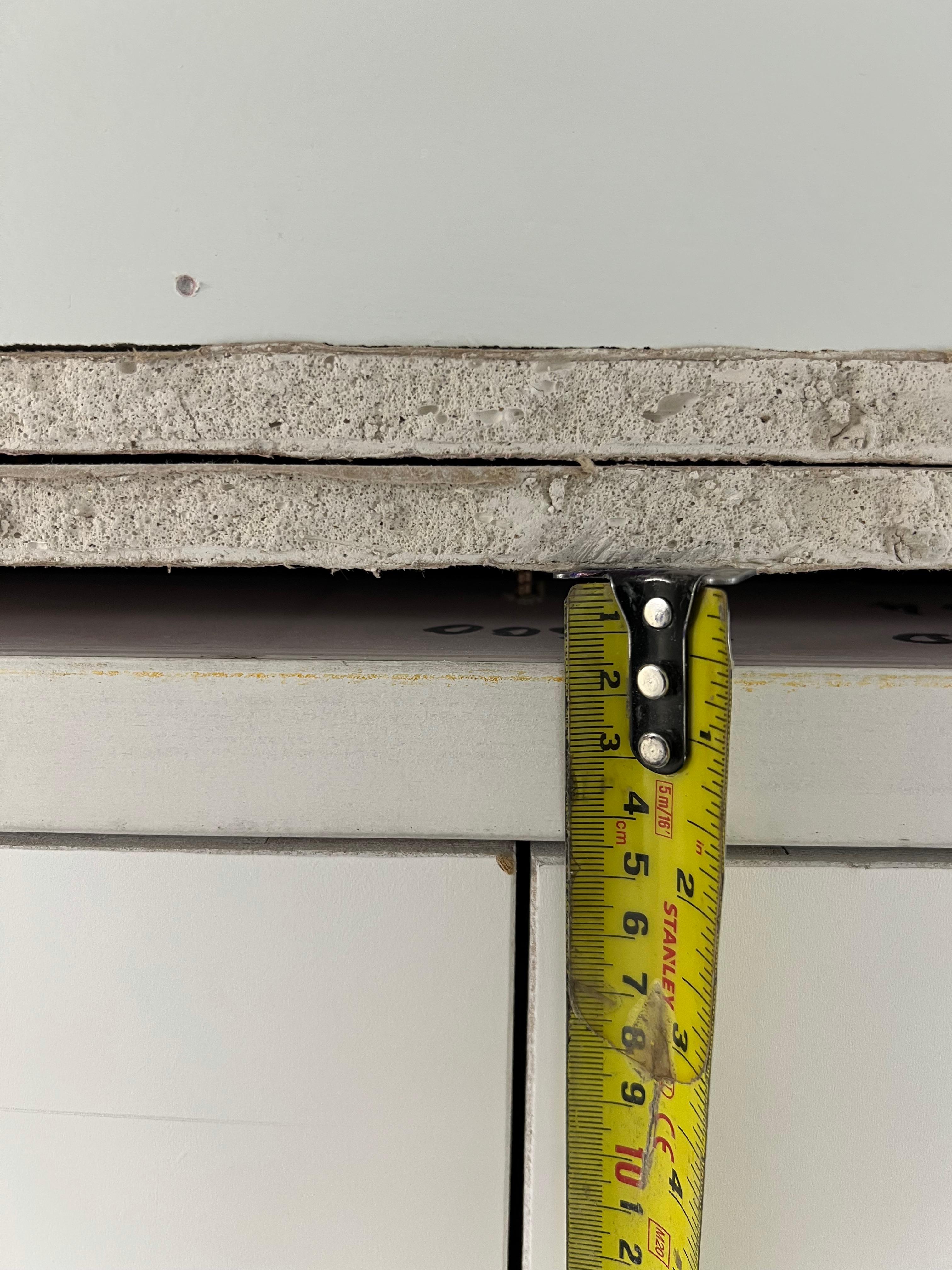 Measuring an exposed opening above the frame, Smithfield Court