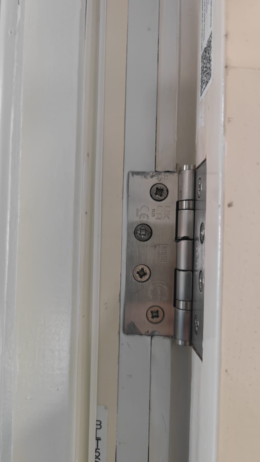 Hinge and door-edge detail during maintenance, Burlington Court