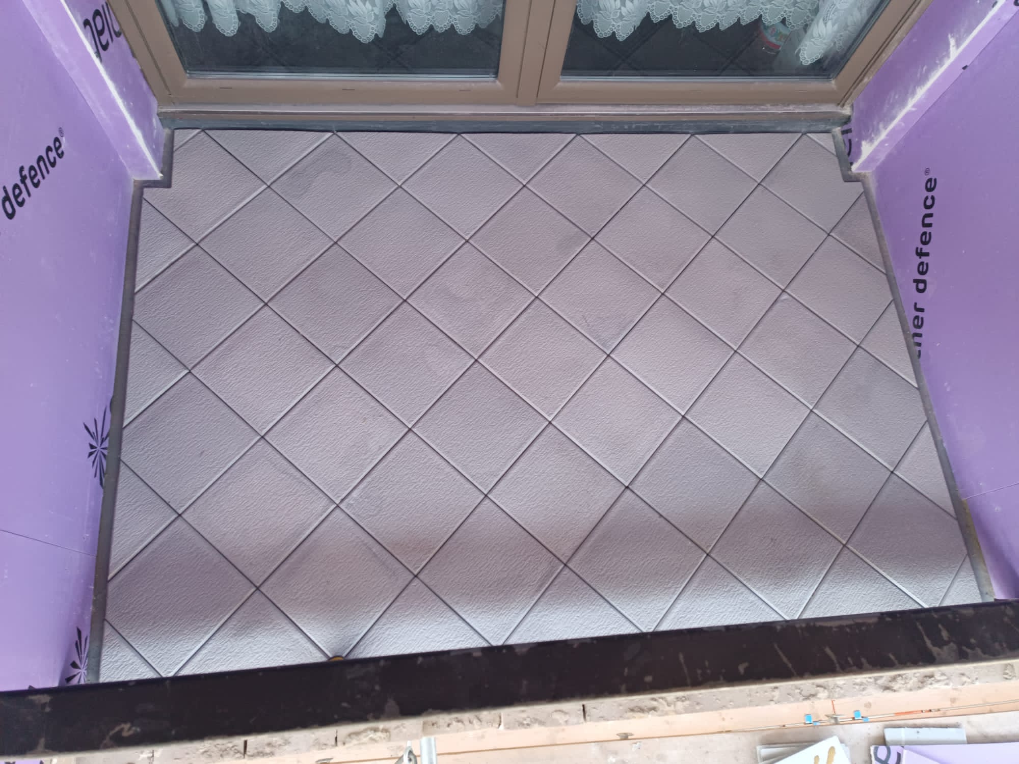 Tiling beside Weather Defence board linings, Oak Square