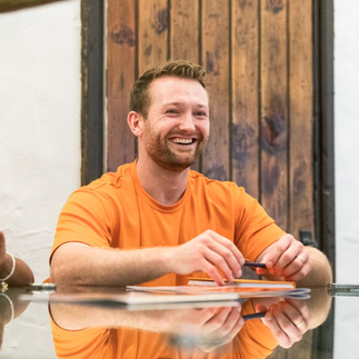 business professional sitting in a meeting room for team meeting by Rachel Thornhill Photography