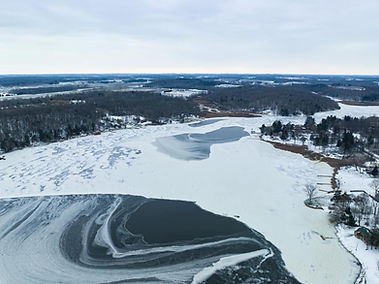 Frozen lake and snow-covered landscape