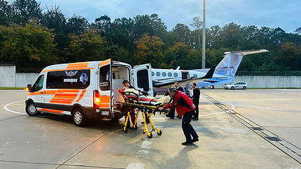 SkyCare Global air ambulance arrival with patient transfer to a ground ambulance after a safe mission