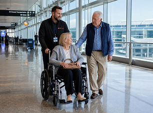 SkyCare Global medical escort assisting wheelchair traveler and travel companion with airport support prior to departure