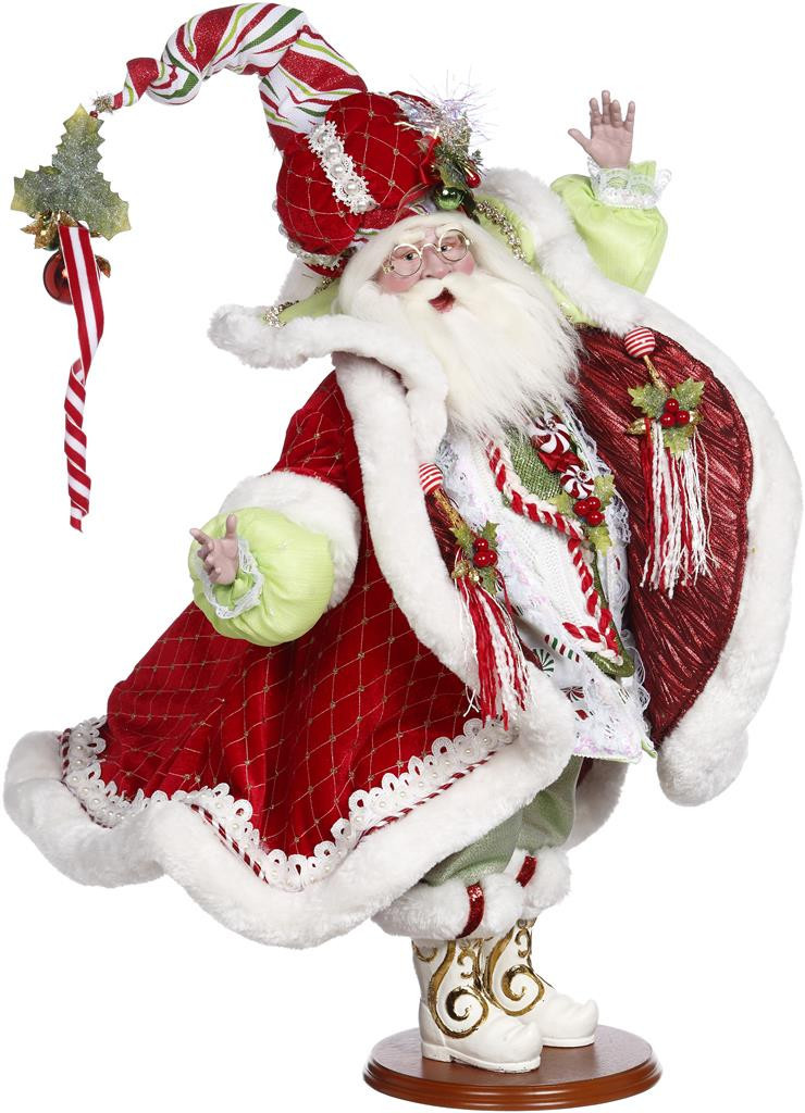 Side view of Mark Roberts Candy Cane Santa Doll showing long curved whimsical hat and luxury red velvet detailing