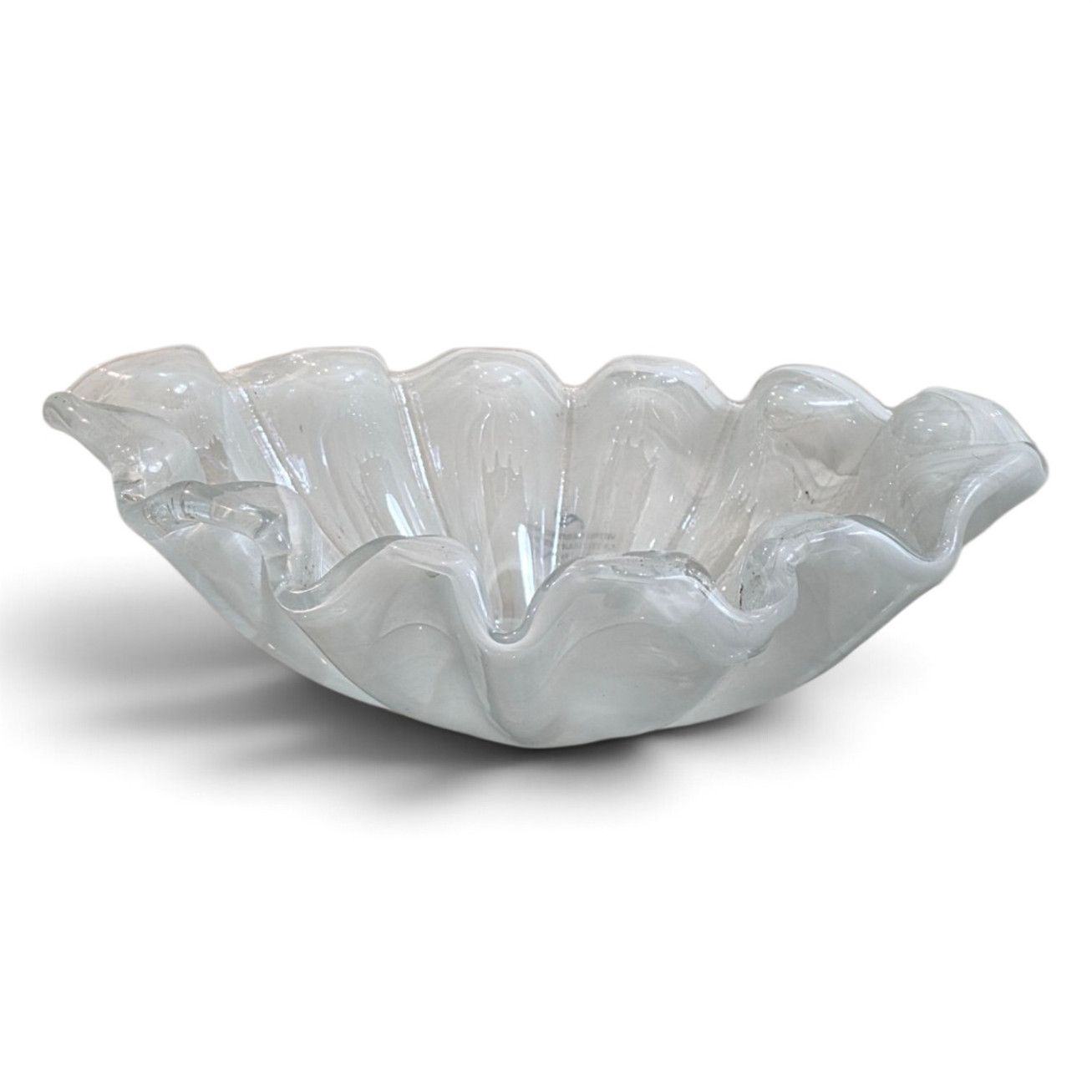 Handcrafted Italian Murano glass display bowl with rippled edge on white background.