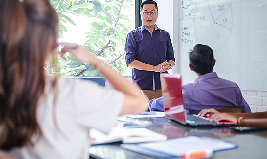 Speaker at whiteboard.png