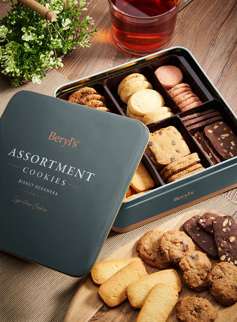 an assortment of cookies in a tin