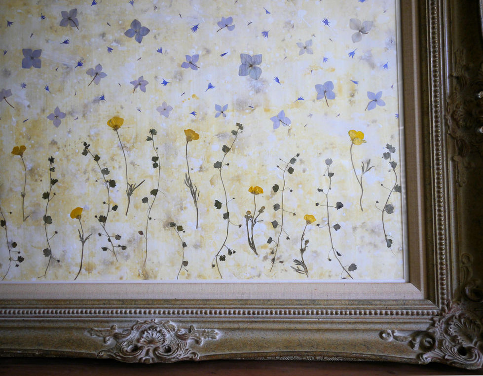 This is a close up of the original pressed flower artwork of Purple & Yellow Wildflowers by Sarah Cadman.