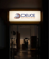 a sign for Deuce Sports Advisory & Services is lit up at signage board.