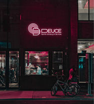 Neon Logo for Deuce Sports Advisory and Services with Logo icon made up of D with intergated icon.