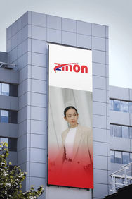 A sign on the side of a building that says anon