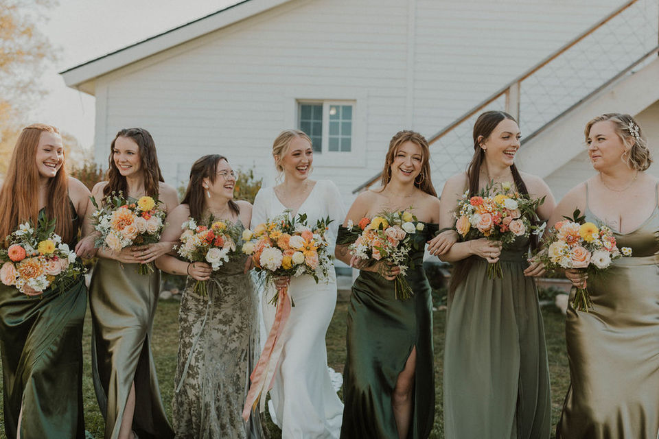 Montana wedding Barn at Homestead on McVey and bridesmaids with citrus toned bouquets and green dresses